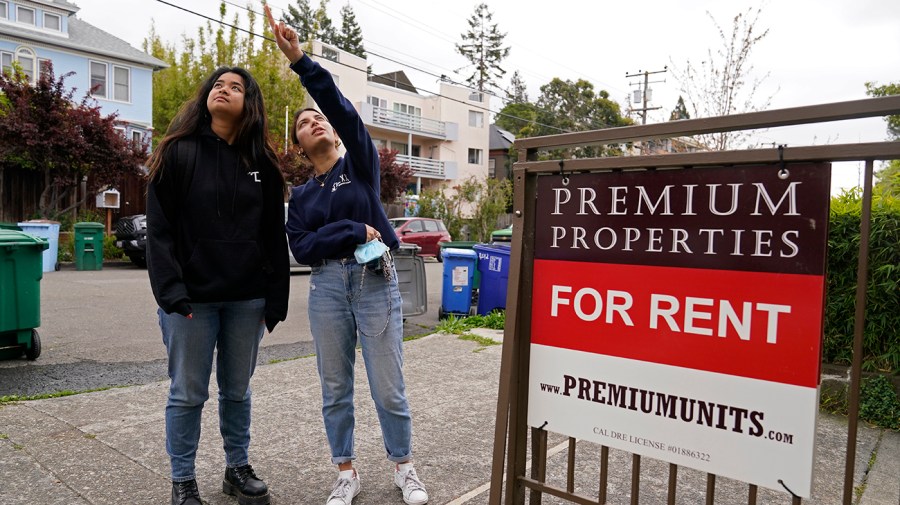 Students look at apartments for rent