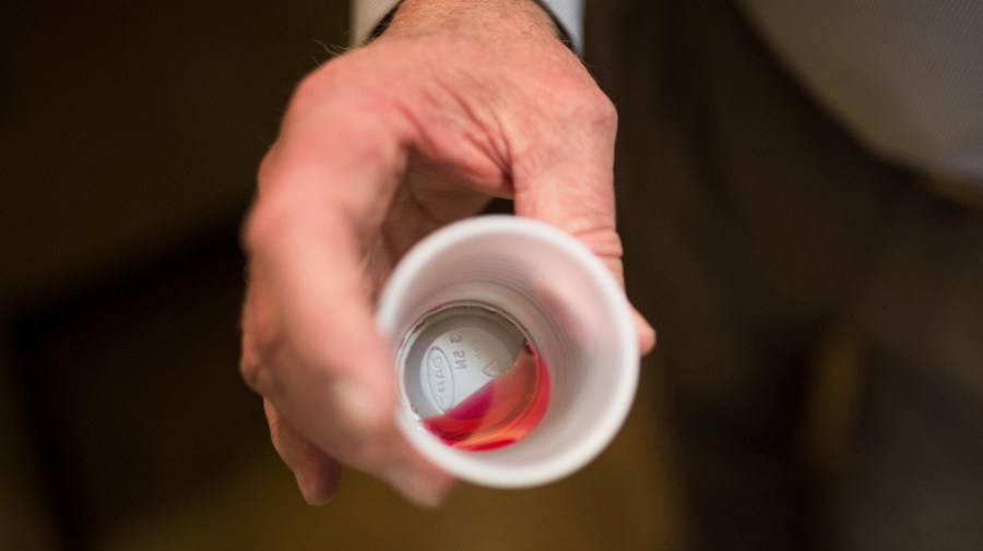 FILE - Paul "Rip" Connell, CEO of Private Clinic North, a methadone clinic, shows a 35 mg liquid dose of methadone at the clinic in Rossville, Ga., on March 7, 2017.