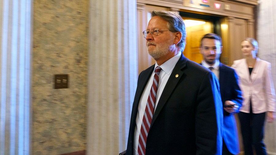 Sen. Gary Peters (D-Mich.) arrives for a procedural vote regarding the nomination of Julianna Michelle Childs to be United States Circuit Judge for Washington, D.C., on Thursday, July 14, 2022.