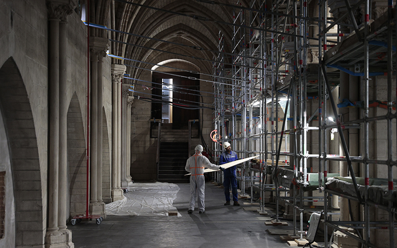 People work at the construction site of Notre Dame Cathedral