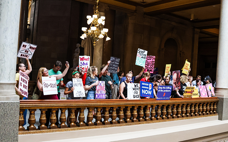 Abortion rights protesters gather in the Indiana Statehouse