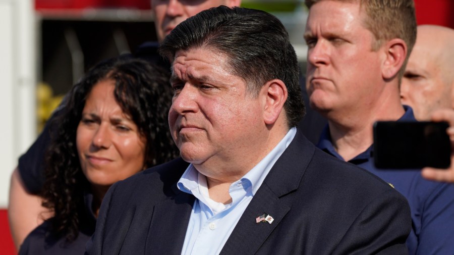 Illinois Gov. J.B. Pritzker (D) attends a news conference at the Highland Park Fire Department.