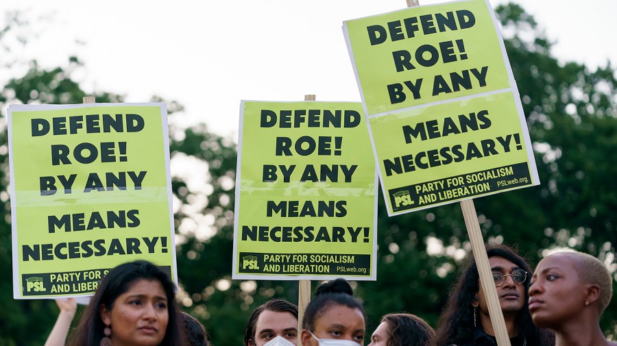 Protesters for abortion rights demonstrate outside the Supreme Court on Friday, June 24, 2022 after the court released a decision to strike Roe v. Wade.