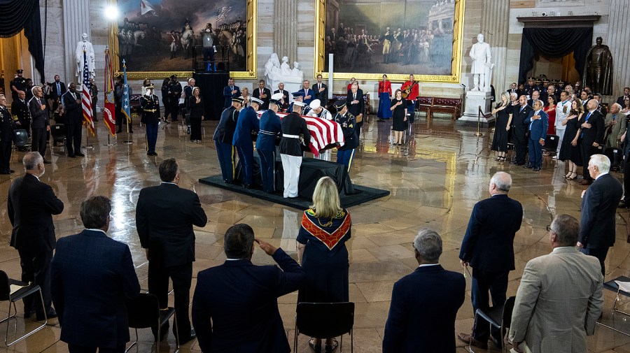 A casket team from the Military District of Washington places Herschel "Woody" Williams' flag-draped casket onto the Lincoln catafalque in the Capitol Rotunda where he will lay in honor on Thursday, July 14, 2022. Williams, the last surviving World War II Medal of Honor recipient, fought at the Battle of Iwo Jima.