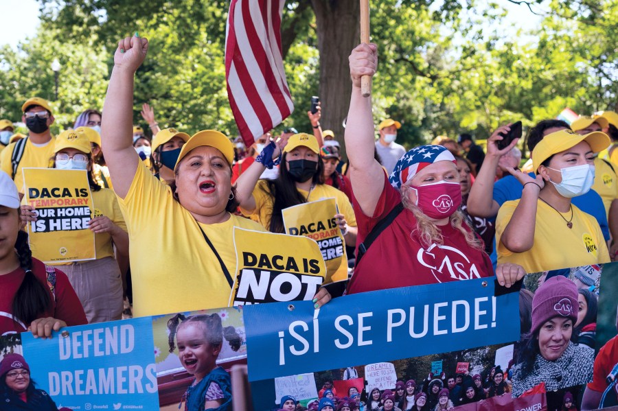 FILE - Ingrid Vaca, left, a native of Bolivia, helps to energize activists to rally in support of the Deferred Action for Childhood Arrivals program, also known as DACA, at the Capitol in Washington, June 15, 2022.