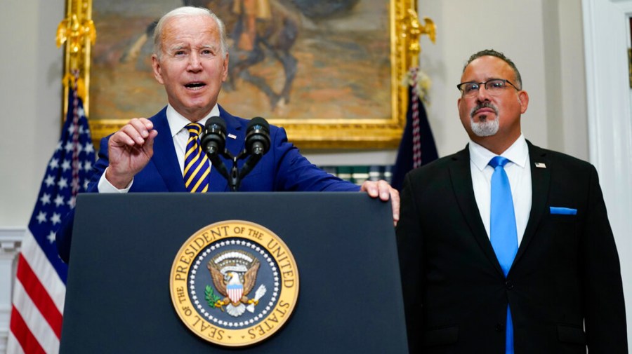 Joe Biden and Miguel Cardona