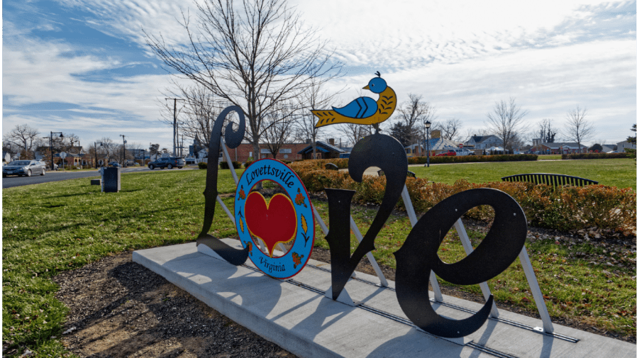 The 'Love' sign welcomes neighbors and passers-by on the rounded town square that they call the "Squirkle" in Lovettsville, Va.,on Dec. 24, 2021.