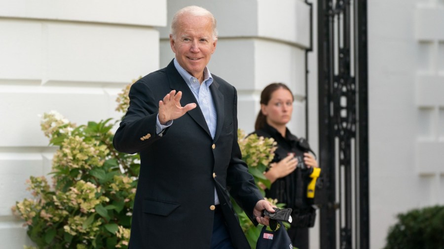 President Joe Biden waves as he walk to board Marine One on the South Lawn of the White House in Washington.