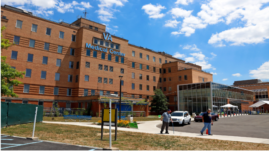 FILE - In this July 14, 2020 file photo, people walk outside the Louis A. Johnson VA Medical Center in Clarksburg, W.Va.