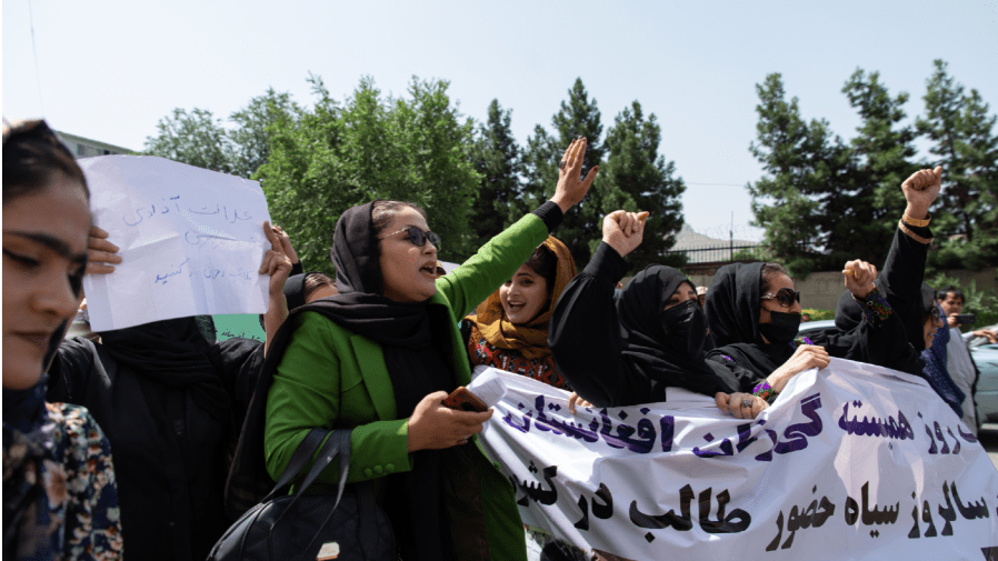 KABUL, AFGHANISTAN - AUGUST 13: Taliban fighters fired into the air as they dispersed a rare rally by women as they chanted "Bread, work and freedom" and marched in front of the education ministry building, days ahead of the first anniversary of the hardline Islamists' return to power, on August 13, 2022 in Kabul, Afghanistan.