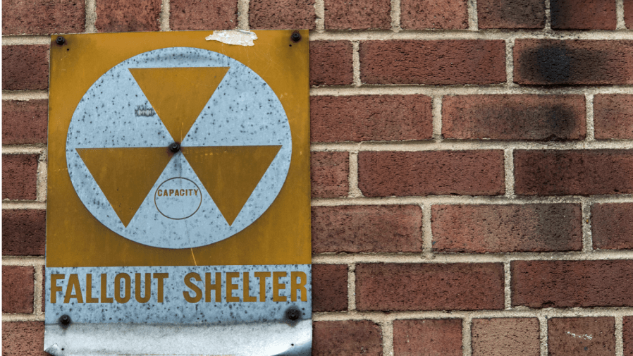 FILE - A fallout shelter sign hangs on a building on East 9th Street in New York, Jan. 16, 2018.