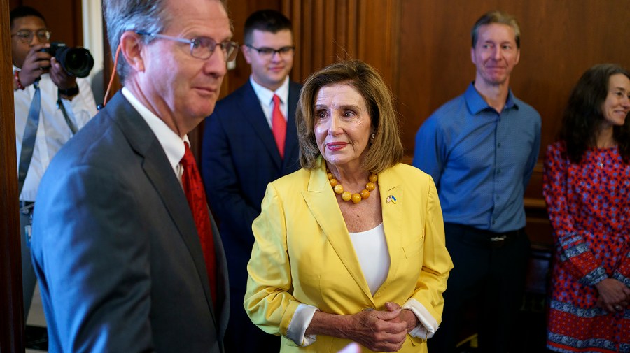 Speaker Nancy Pelosi (D-Calif.) speaks with Rep. Tim Burchett (R-Tenn.)