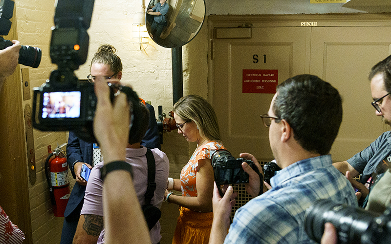 Sen. Kyrsten Sinema (D-Ariz.) waits for an elevator