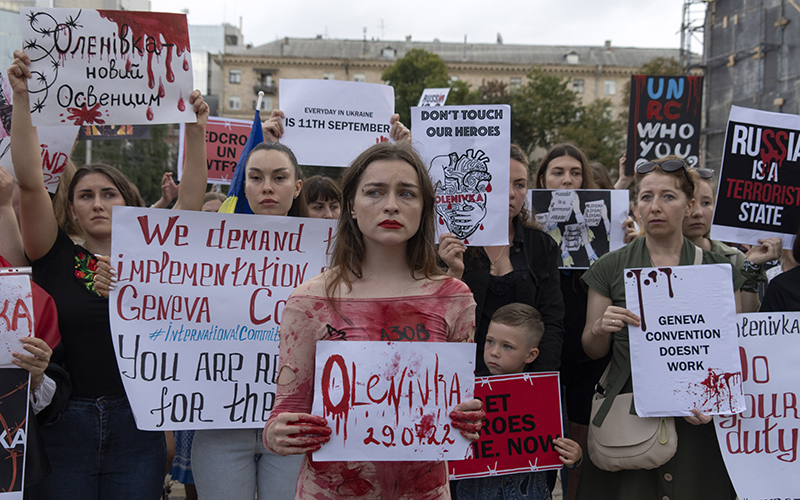 Protesters attend a rally in support of Ukrainian soldiers