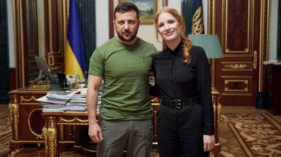 Ukrainian President Volodymyr Zelenskyy and actress Jessica Chastain pose for a photo in Kyiv.