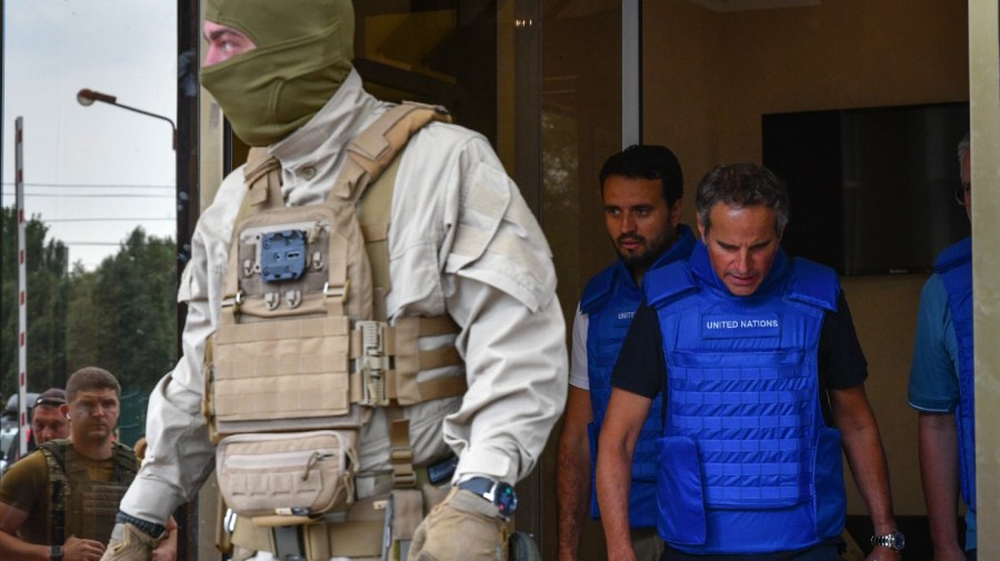 Director General of the International Atomic Energy Agency (IAEA) Rafael Mariano Grossi, right, leaves the hotel as a mission of the International Atomic Energy Agency prepare to visit the Zaporizhzhia nuclear power plant, in Zaporizhzhia, Ukraine, Thursday, Sept. 1, 2022.