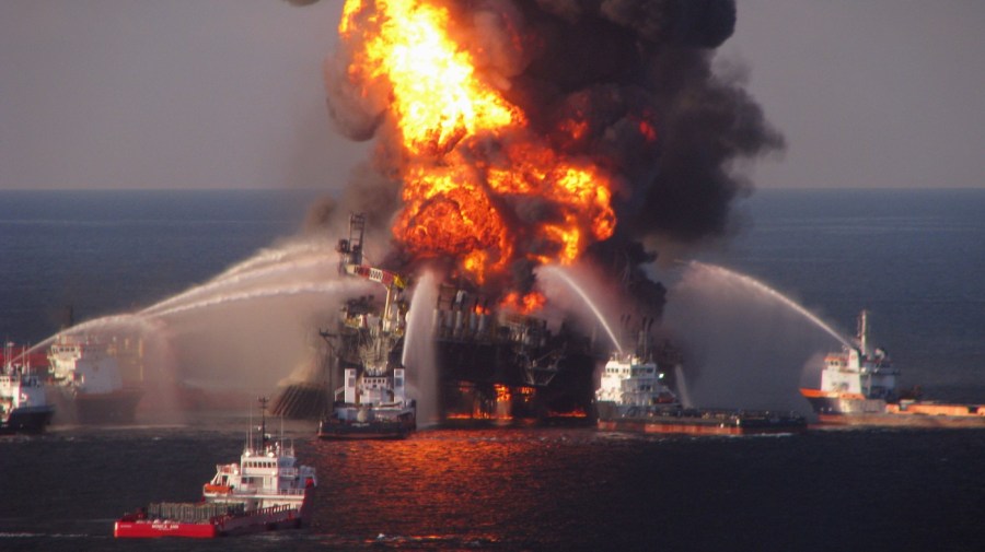 In this April 21, 2010 file photo provided by the U.S. Coast Guard, fire boat response crews spray water on the burning BP Deepwater Horizon offshore oil rig.