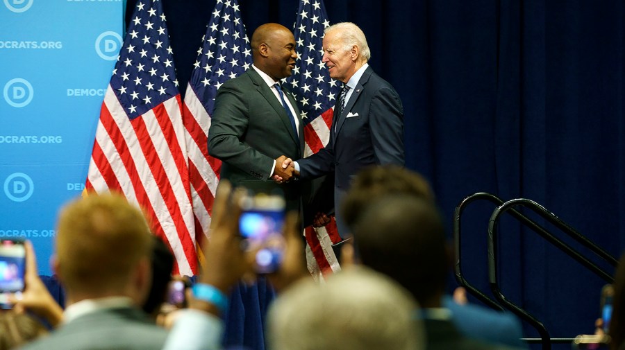 DNC Chairman Jaime Harrison greets President Biden