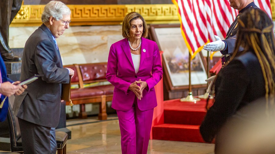 Speaker Nancy Pelosi (D-Calif.) and Minority Leader Mitch McConnell (R-Ky.) depart a ceremony