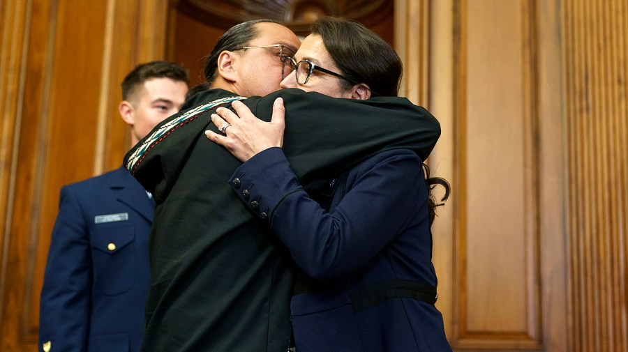 Eugene Peltola hugs his wife Rep. Mary Peltola (D-Alaska)