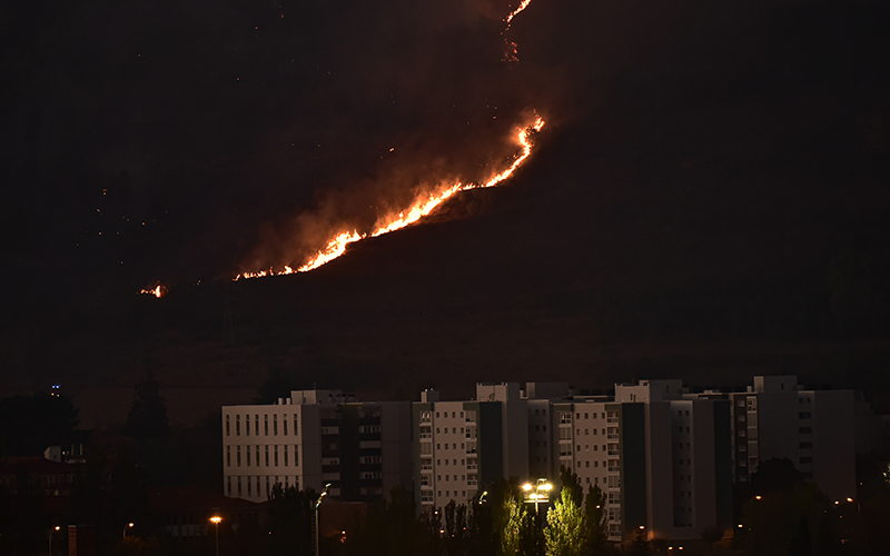 Smoke and fire billows from the top of Ezcaba mountain during a forest fire