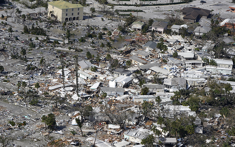 Damaged homes and debris are shown in the aftermath of Hurricane Ian in Fort Myers, Fla.