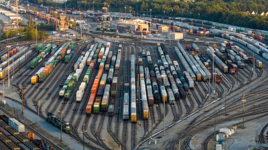 Freight train cars sit in a Norfolk Southern rail yard