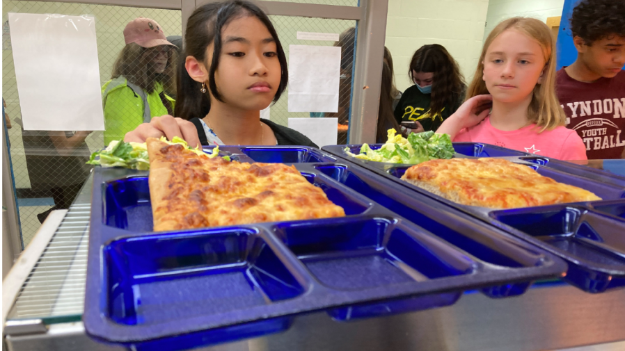 Students get lunch of homemade pizza and caesar salad at the Albert D. Lawton Intermediate School, in Essex Junction, Vt., Thursday, June 9, 2022.