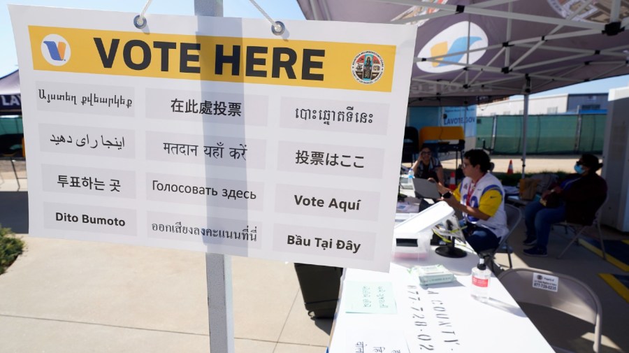 A worker sets up at a voting booth for NFL votes prior to an NFL football game between the San Francisco 49ers and the Los Angeles Rams Sunday, Oct. 30, 2022, in Inglewood, Calif.