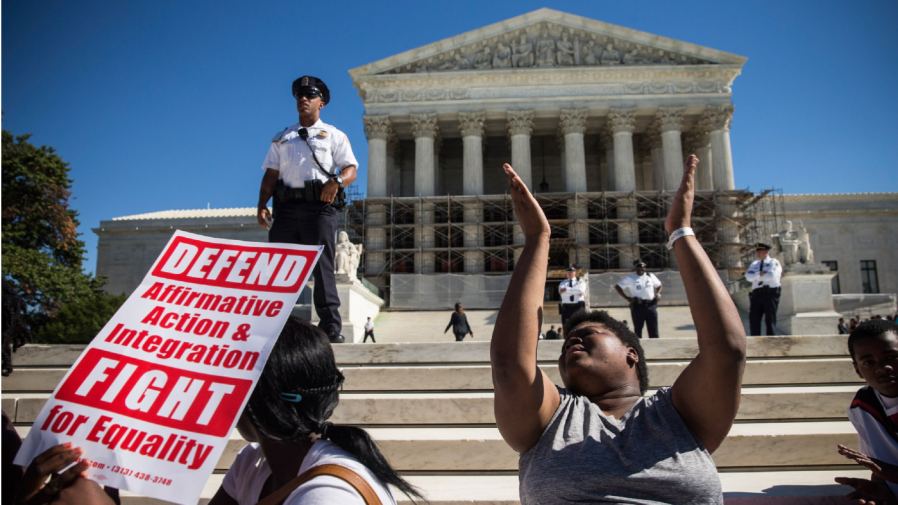 WASHINGTON, DC - OCTOBER 15: Students protest in support of affirmative action, outside the Supreme Court during the hearing of "Schuette v. Coalition to Defend Affirmative Action" on October 15, 2013 in Washington, DC.