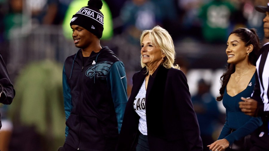 First lady Dr. Jill Biden walks off the field before an NFL football game against the Dallas Cowboys, Sunday, Oct. 16, 2022, in Philadelphia.