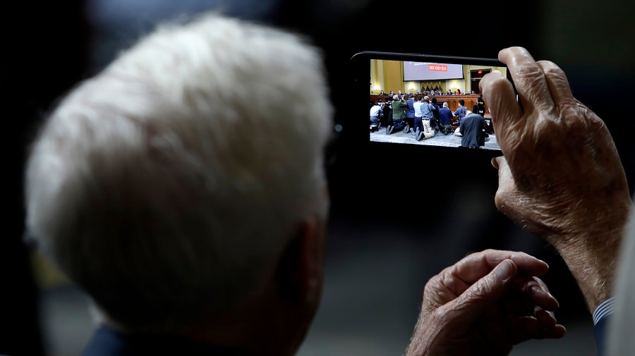 A photo is taken during a House Jan. 6 committee hearing