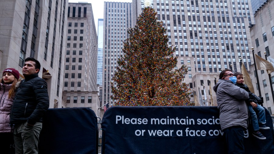 People take part in traditional Christmas Day activities as they gather at Rockefeller Center