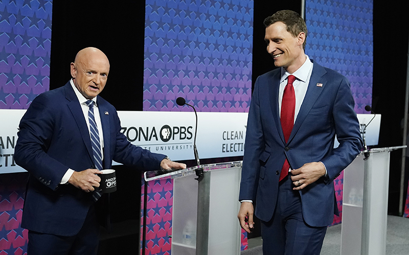 Sen. Mark Kelly (D-Ariz.), left, and his Republican challenger Blake Masters arrive for a debate