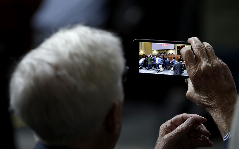 A photo is taken during a House Jan. 6 committee hearing