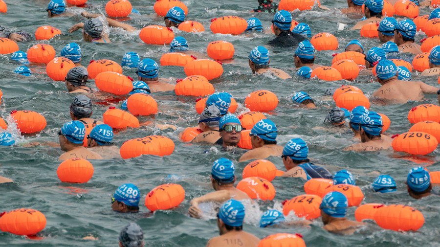 Swimmers compete in the annual harbor race at the Victoria Harbor in Hong Kong