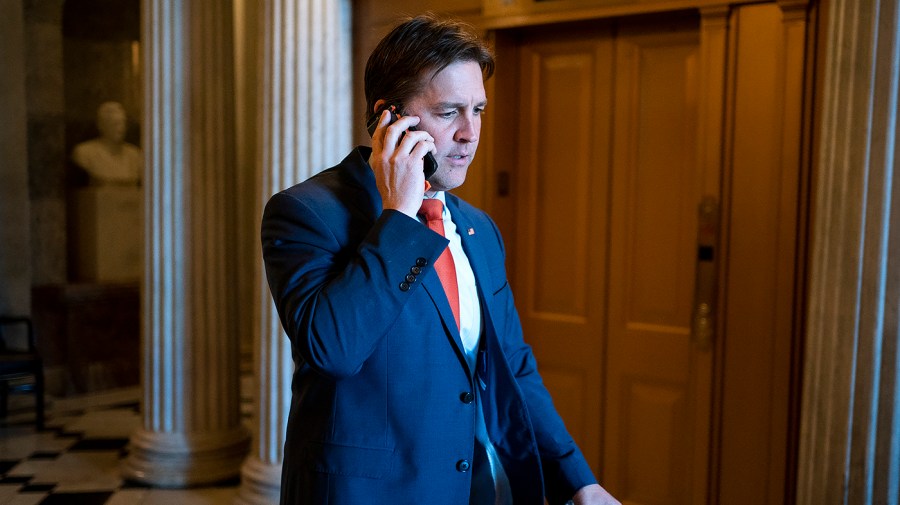 Former Sen. Ben Sasse (R-Neb.) makes a phone call