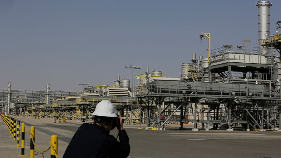 A photographer takes pictures of the Khurais oil field