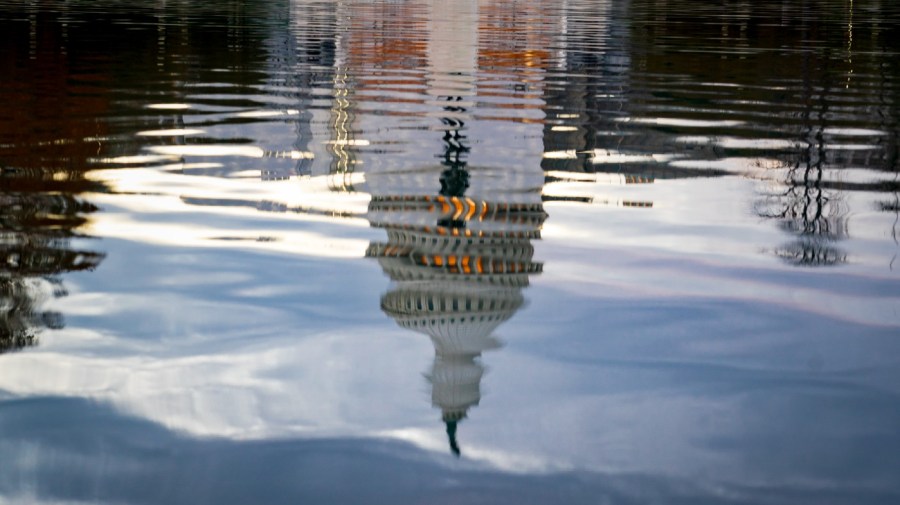 File - The Capitol Dome is seen amid ripples in the reflecting pool, in Washington, Monday, Nov. 7, 2022, one day before Election Day.