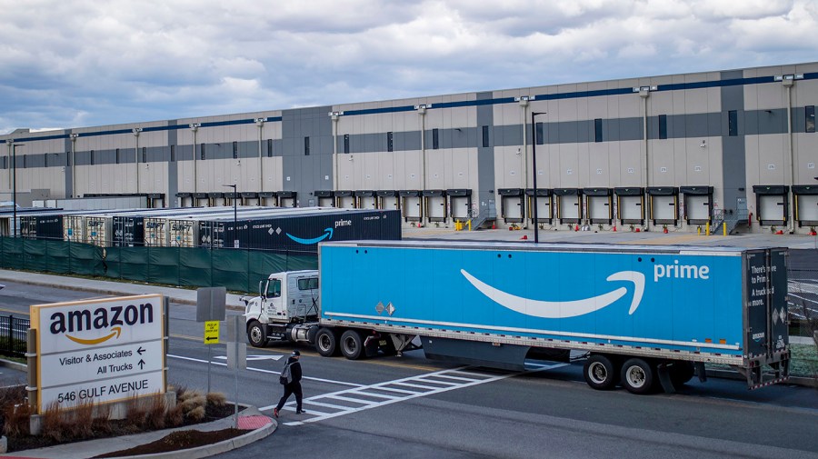 A truck arrives at the Amazon warehouse facility