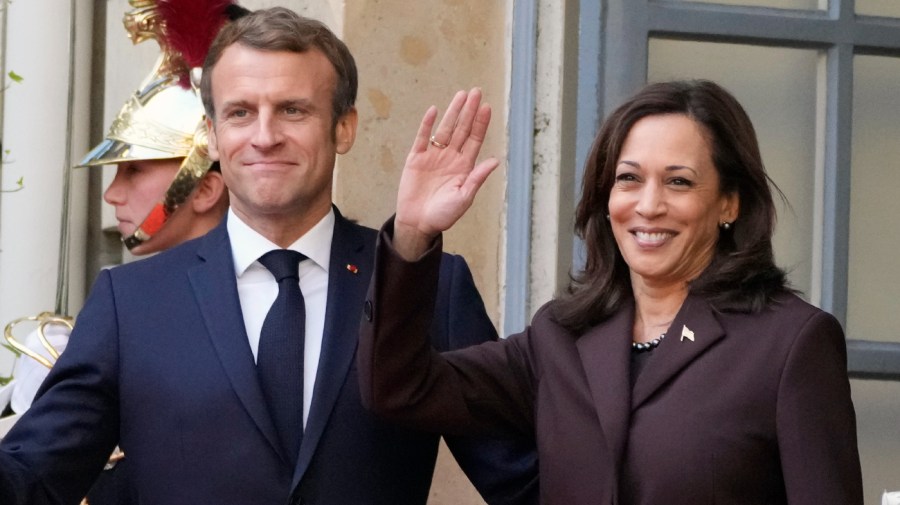 France's President Emmanuel Macron poses with U.S Vice President Kamala Harris