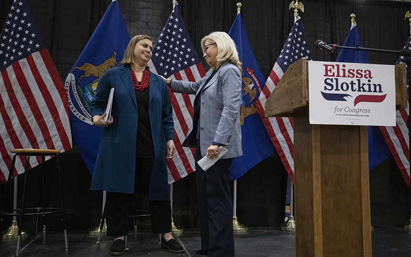 Rep. Liz Cheney (R-Wyo.), right, campaigns with Rep. Elissa Slotkin (D-Mich.)