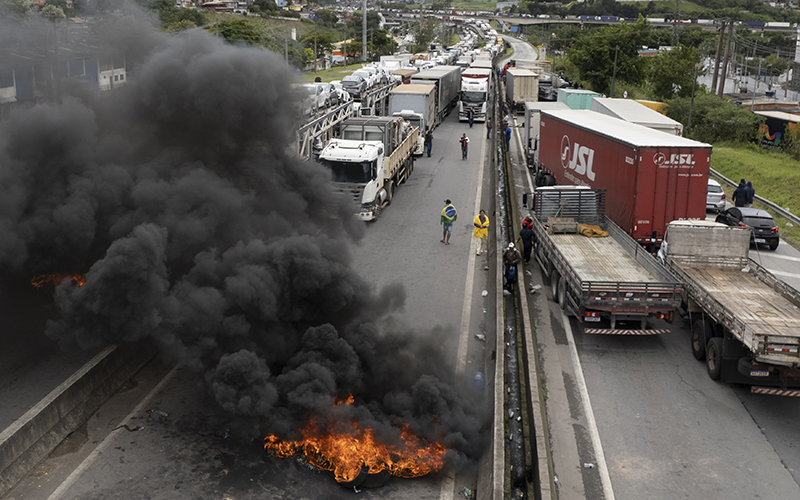 Truckers supportive of President Jair Bolsonaro block a highway