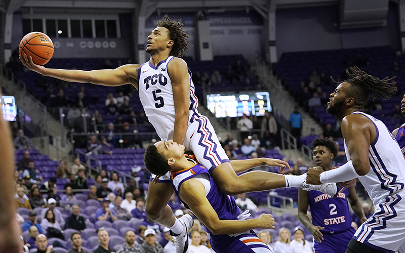 TCU forward Chuck O'Bannon Jr. tries to score over Northwestern State forward Dayne Prim