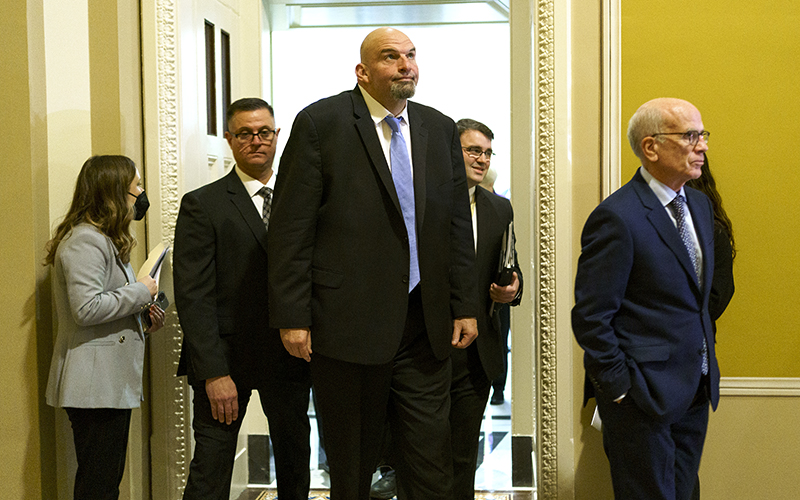 Sens.-elect John Fetterman (D-Pa.) and Peter Welch (D-Vt.) leave the weekly Senate Democratic policy luncheon