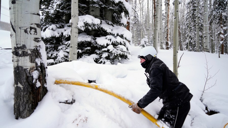 Ian Sidwell adjusts a hose at the Vail Mountain Resort