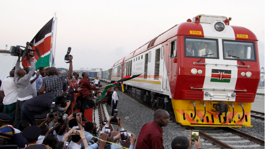 FILE - In this May 30, 2017, file photo, the SGR cargo train rides from the port containers depot on a Chinese-backed railway costing nearly $3.3 billion, opened by Kenya's president as one of the country's largest infrastructure project since independence, in Mombasa, Kenya.