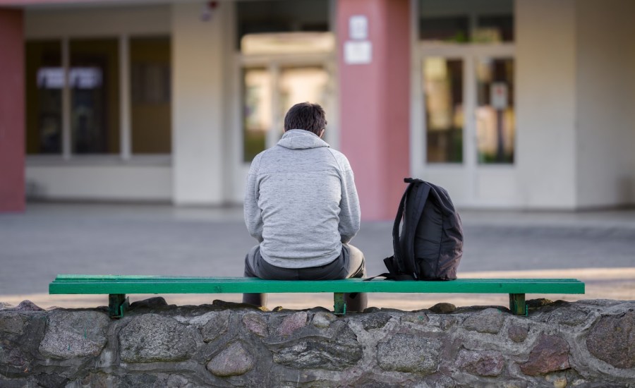 Man alone on bench.