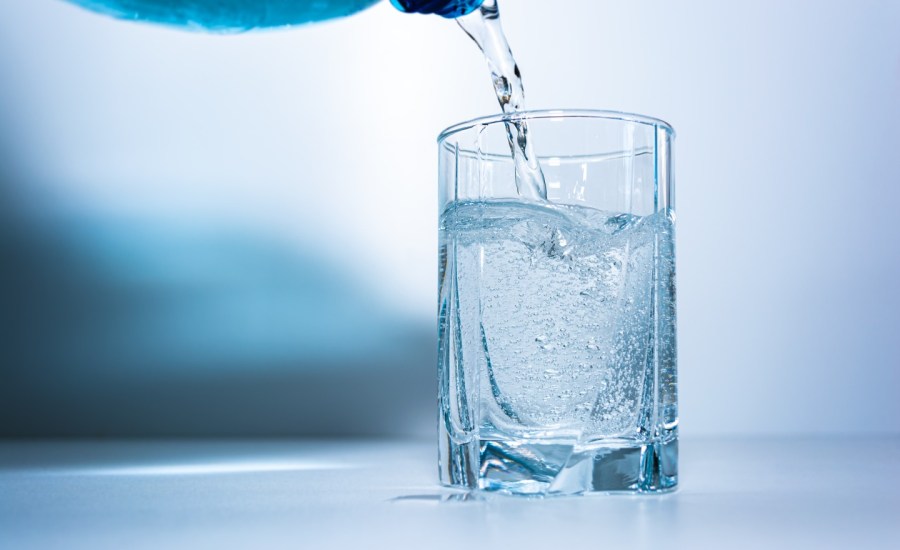 Pouring glass of water.