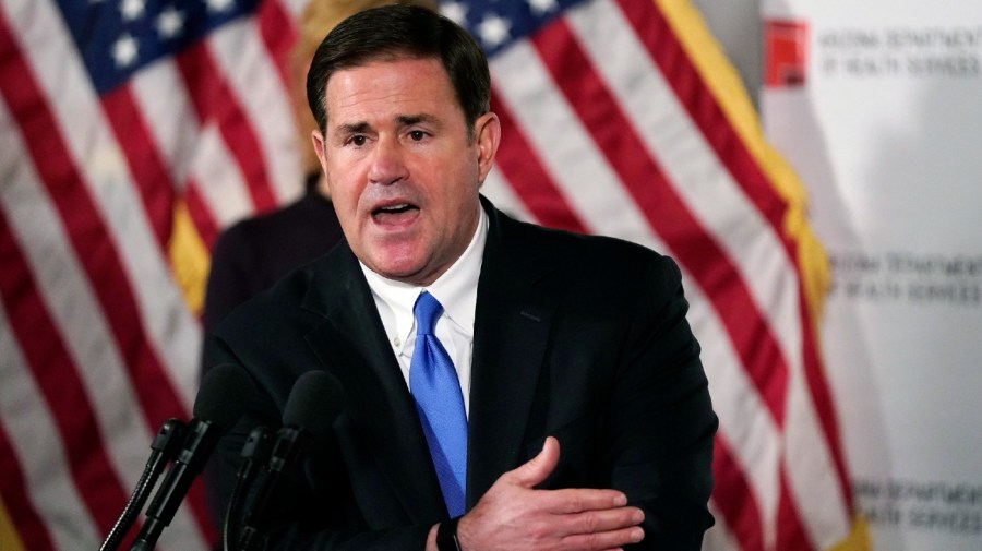 FILE - Arizona Gov. Doug Ducey answers a question during a news conference in Phoenix, on Dec. 2, 2020.